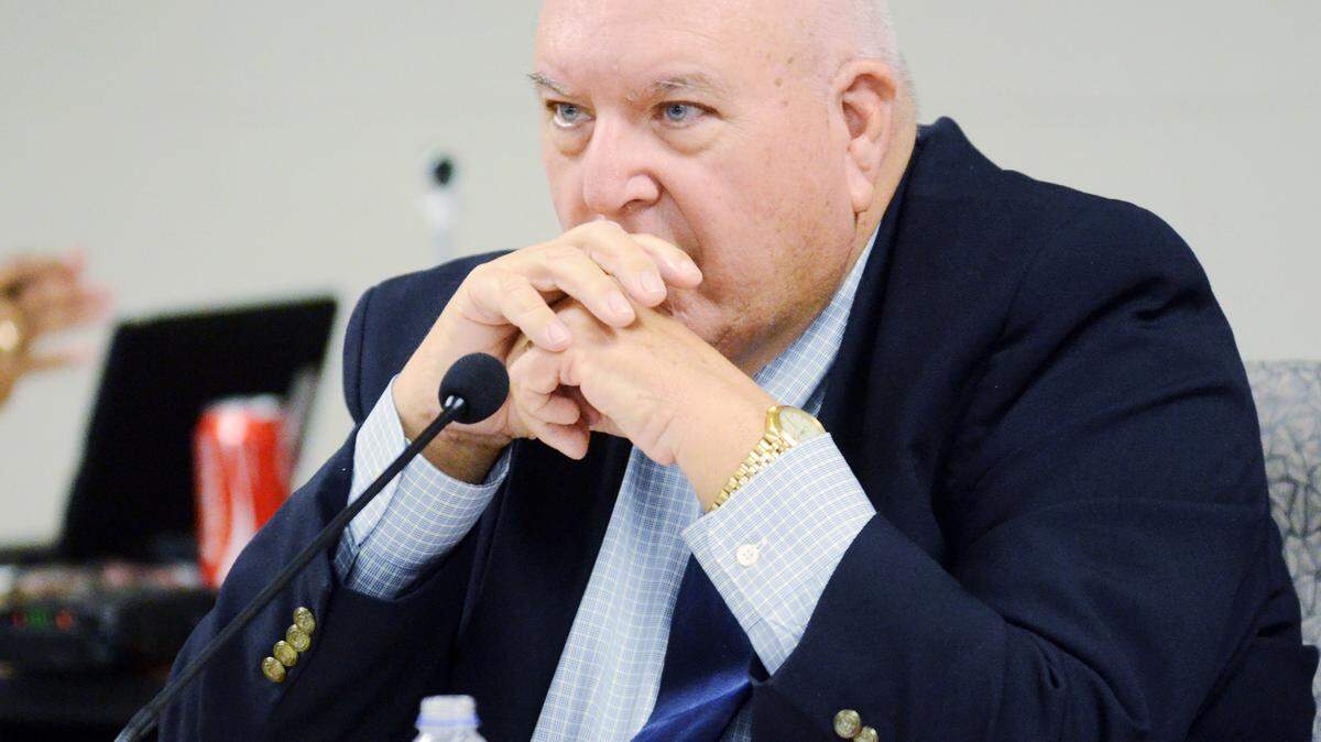Beaufort County School Board chairman Bill Evans listens to the parade of speakers who stood up to criticize the board and district superintendent Jeff Moss during a special school board meeting held on Monday to discuss issues surrounding the hiring of Moss' wife to an administrative position with the district.