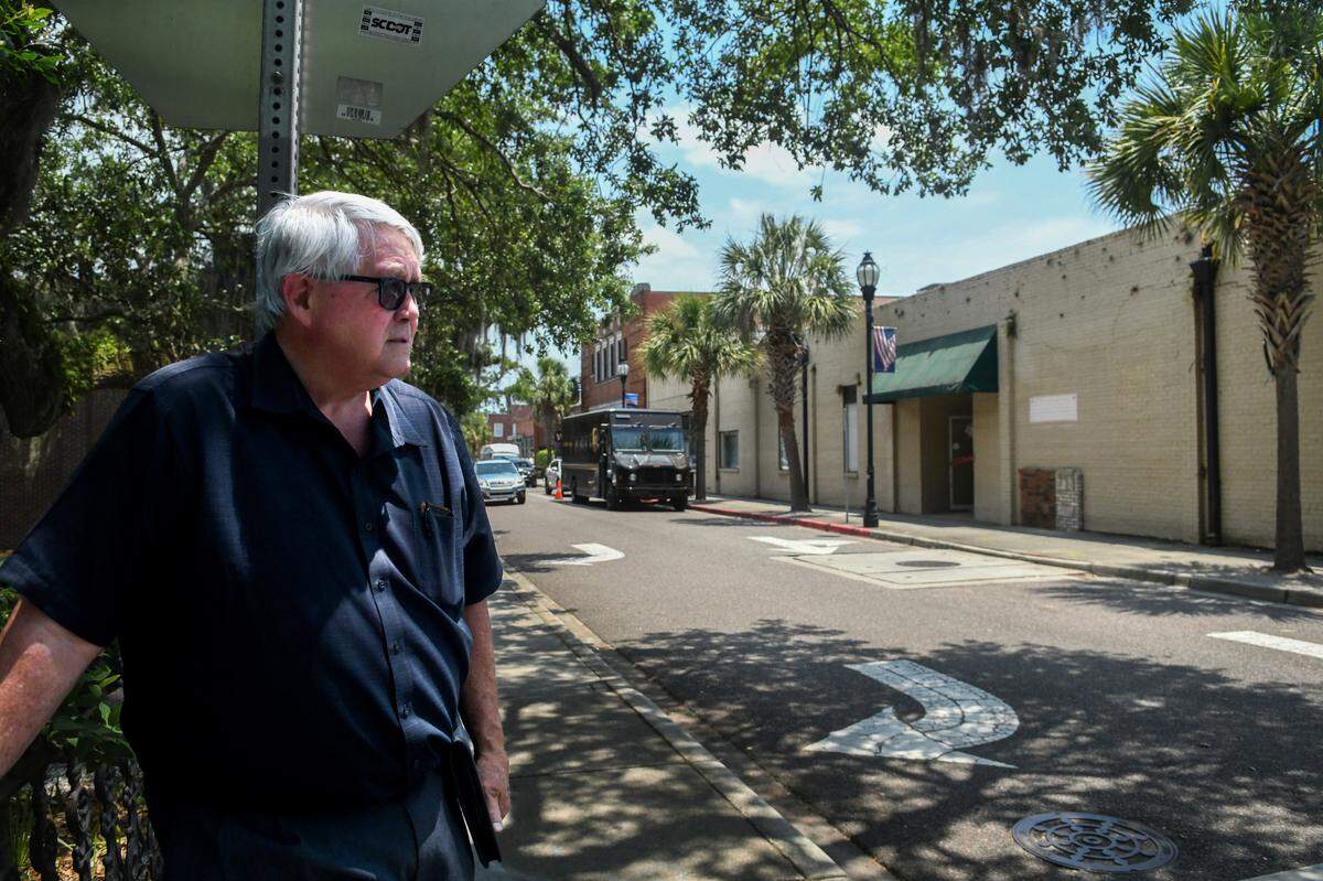 Dick Stewart of 303 Associates, stands at the corner of Port Republic and Charles streets on May 30, 2023 looking at the site where he plans to build apartments while a future hotel and parking garage have been delayed due to legal and high construction costs.