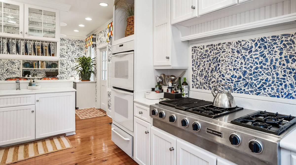 A previous owner created the stove back splash out of shattered old Blue Willow china.