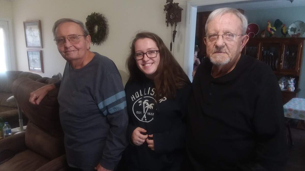 Twin brothers Larry Stowe, left, and Garry Stowe, right, are photographed with Beaufort resident Christy Stowe, Garry’s granddaughter. Larry and Garry died within a week of each other last month.