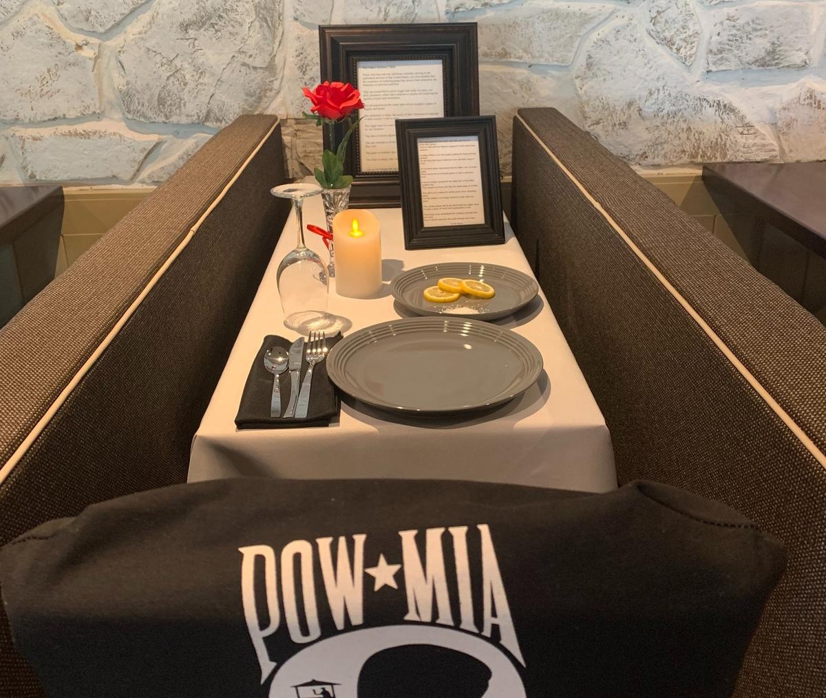 This table set up at Top Dawg Tavern on Hilton Head pays tribute to service members who did not come home.