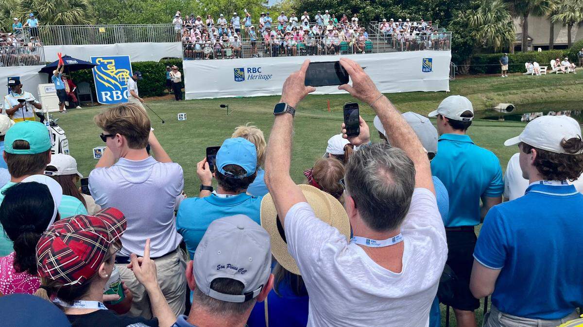 Spectators gathered around the first hole to watch Justin Thomas tee off on Friday, April 18, 2025
