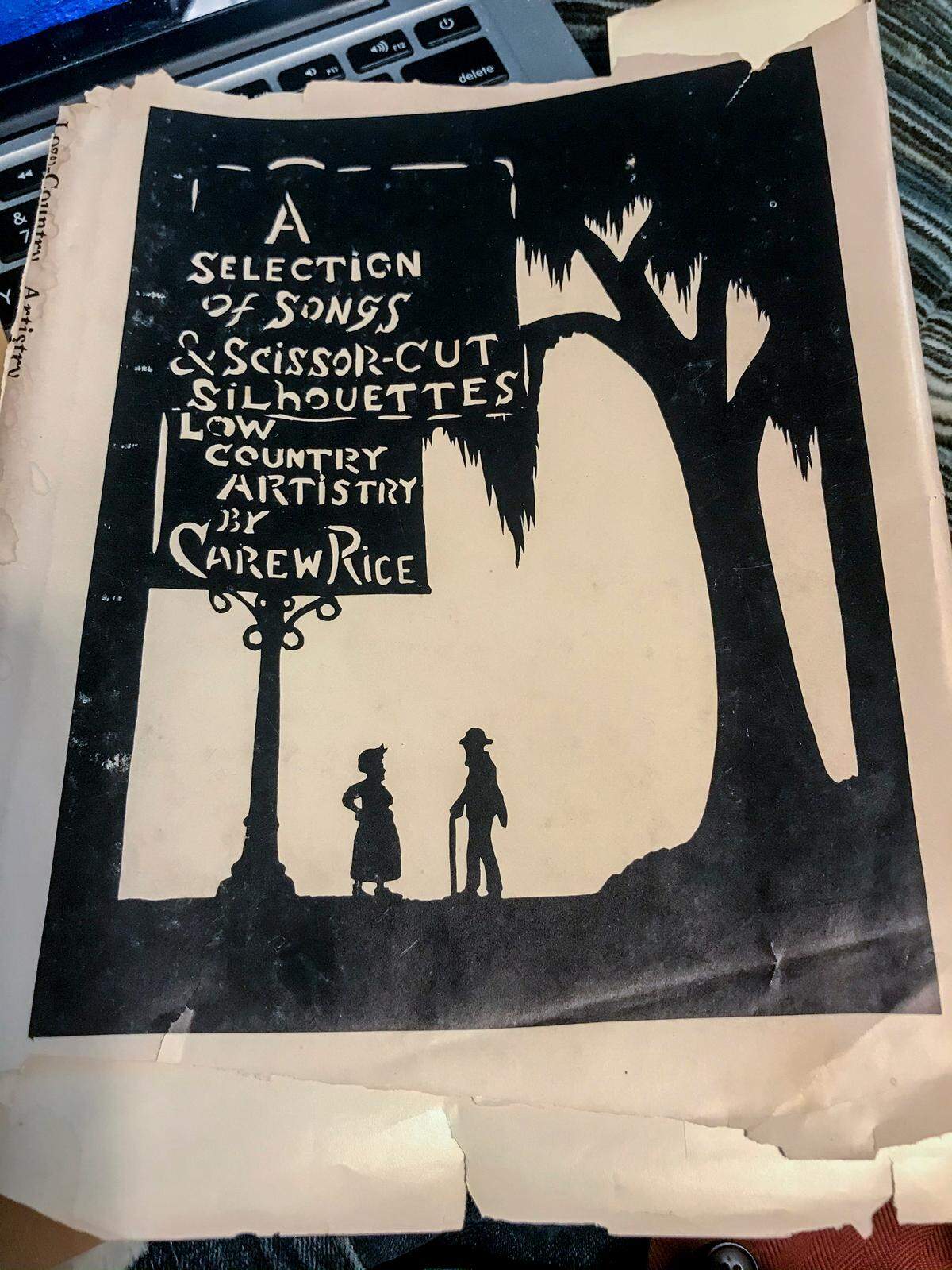 The tattered book cover to Carew Rice’s 1962 book, “A Selection of Songs and Scissor-Cut Silhouettes: Lowcountry Artistry.”
