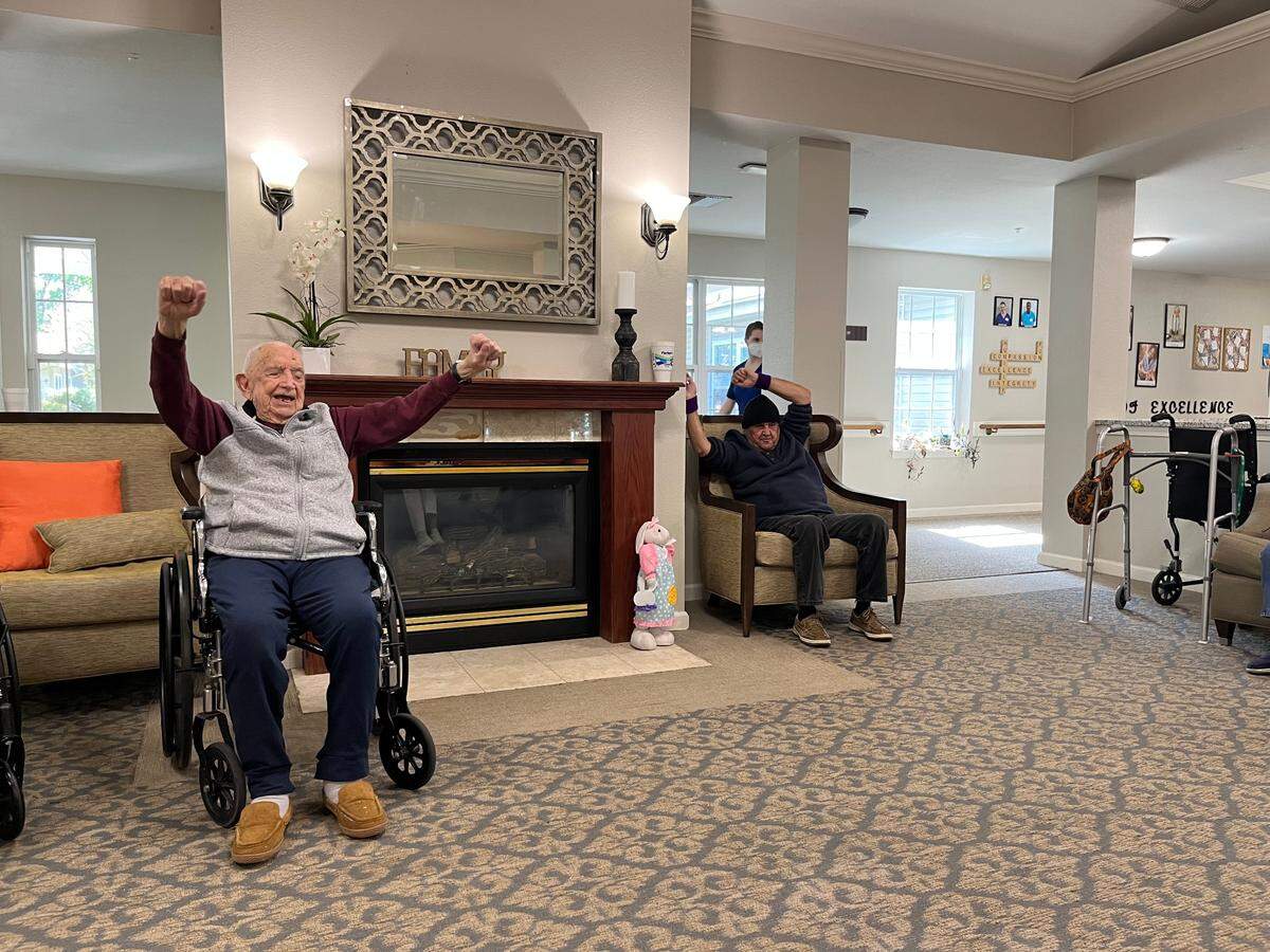 Bill Stultz leads morning exercises at Helena Place Senior Living in Port Royal. Stultz will be 103 next week, on Tuesday. Eutelle Nix, a fellow resident, will be 110 Friday. Stultz has the words to an exercise program that residents follow memorized and calls out the routines in advance.