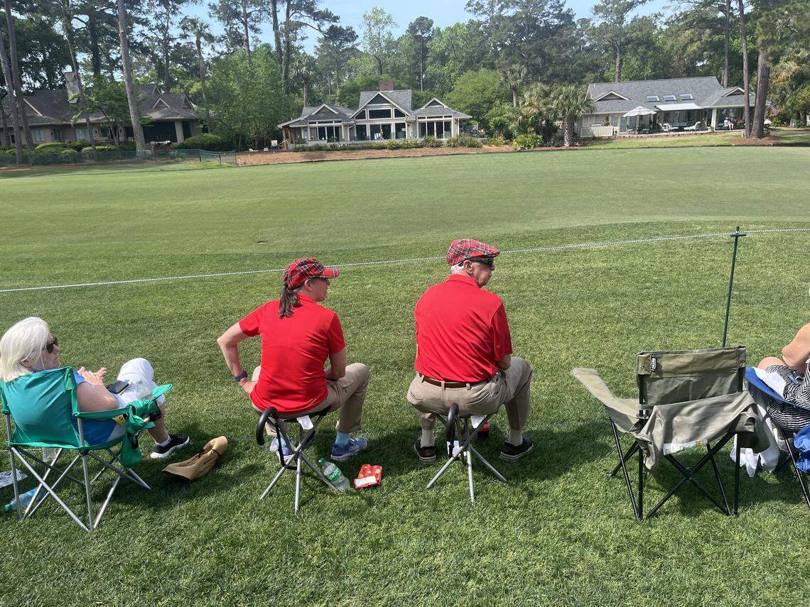 Danielle and Carl Muthersbaugh of Savannah enjoy the action during Plaid Nation day at the RBC Heritage Saturday.