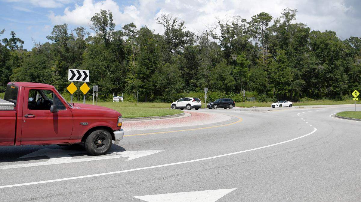 A red Ford F-150 travels north around the S.C. 46 and S.C. 170 traffic circle on Thursday afternoon as other vehicles heading south on May River Road (S.C. 46) wait to enter the circle. A developer wants to build May River Crossing,  commercial space nearly 135,000-square feet on the 25.25 acre northeast corner. The site was formerly known as Towne Centre at New Riverside.