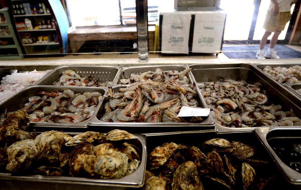 Shrimp and oysters are shown at Sea Eagle Market on Boundary Street in Beaufort.