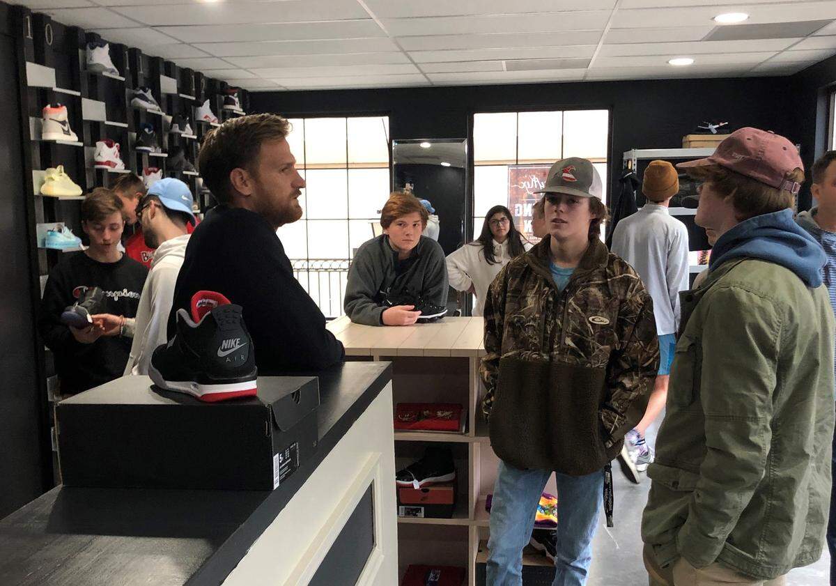 Corey Pennington speaks to customers at Pennykix in Bluffton’s Berkeley Place.