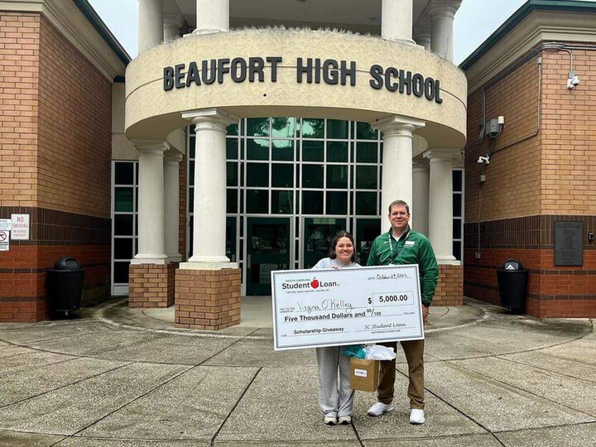 Beaufort High School senior, Virginia O’Kelley, was selected in a random drawing for a $5,000 college scholarship from the South Carolina Student Loan Corp. She’s the first applicant this year to win an award of this sum. On the right is BHS Principal Ryan Walsh.