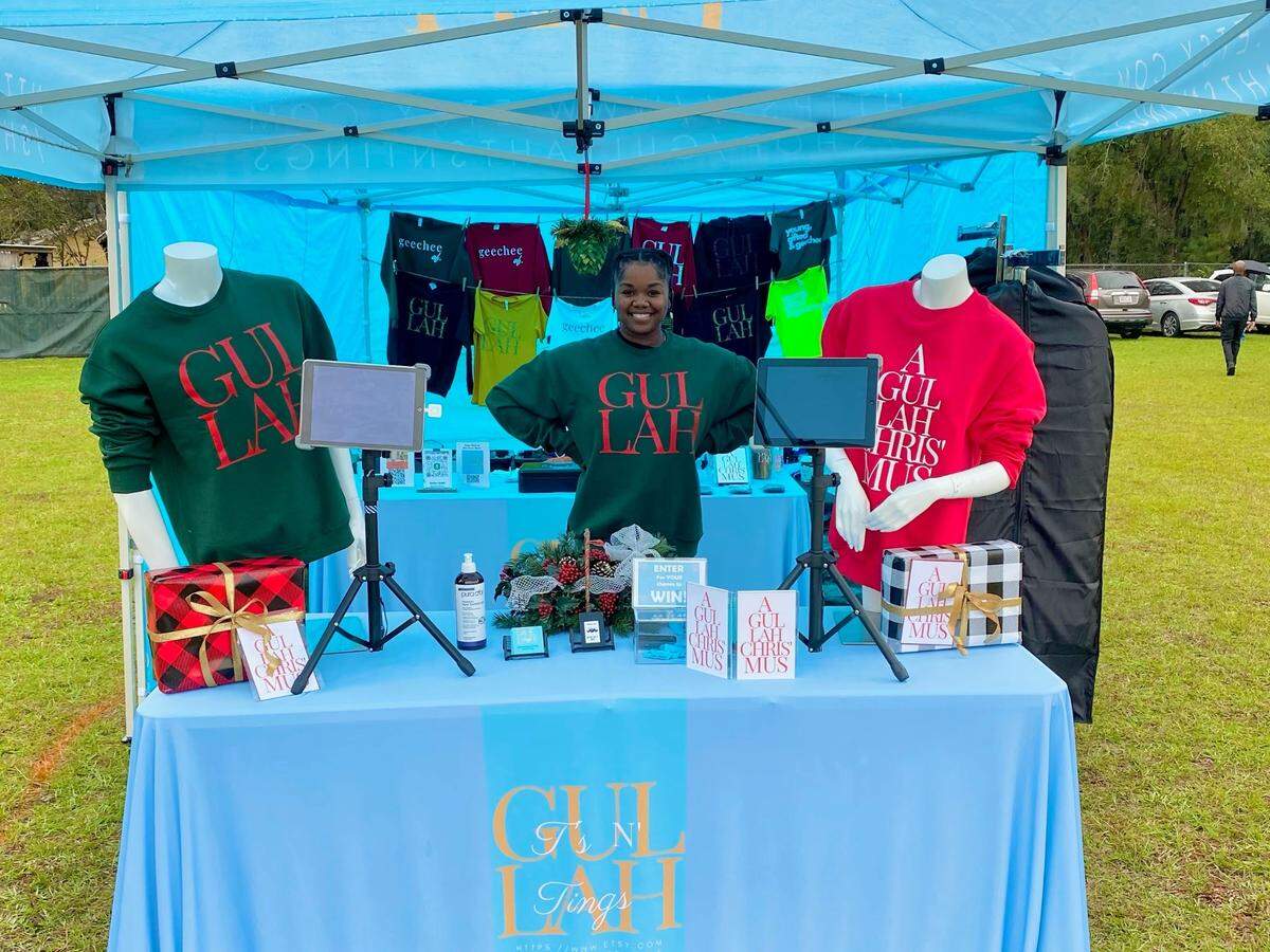 Sonya Grant is photographed in a booth for her clothing business, Gullah Ts N’ Tings, which she launched in June.