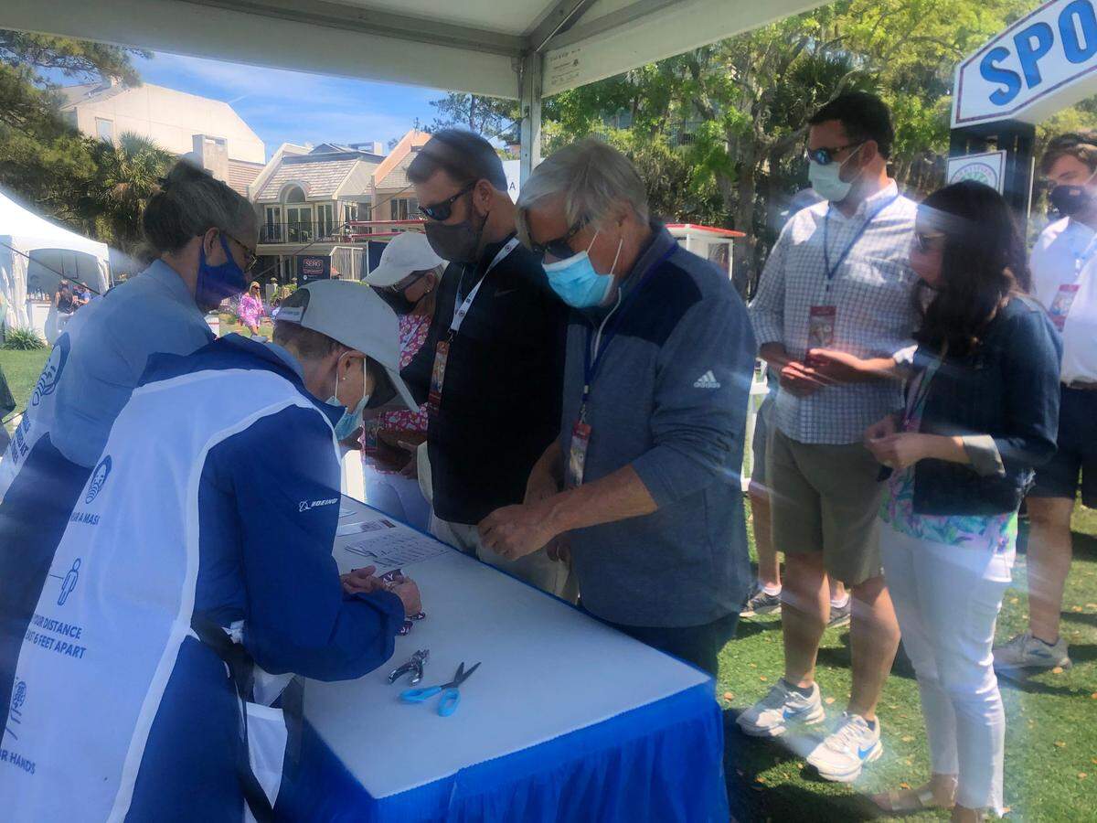 Volunteers punch tickets at the sponsor village at RBC Heritage Presented by Boeing 2021.