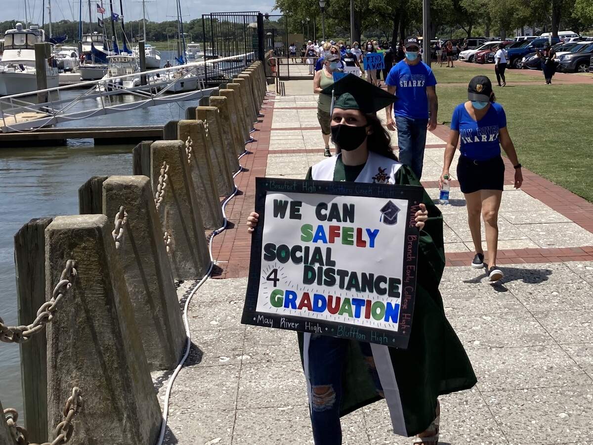 Beaufort High School senior Heather Butler walks with high school seniors and parents from throughout Beaufort County to protest the school district’s plans for virtual graduation ceremonies in Henry C. Chambers Waterfront Park in Beaufort on Saturday, May 16, 2020.