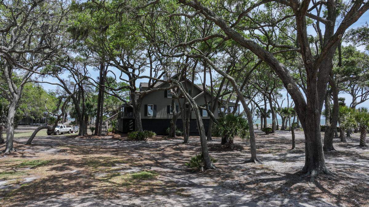 Shadows from the live oaks dapple the surface of the sandy soil as Ted Turner’s former home is photographed on May 8, 2026, on St. Phillips Island, a barrier island now owned by South Carolina State Parks.