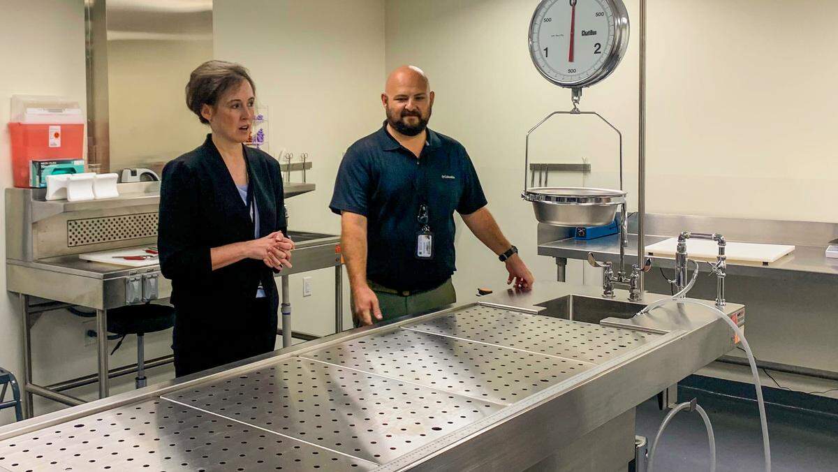 Dr. Joni Skipper (left) and her assistant, Sheldon Phillips (right), will perform autopsies for the county. Skipper is the first forensic pathologist to be a county employee in the state.