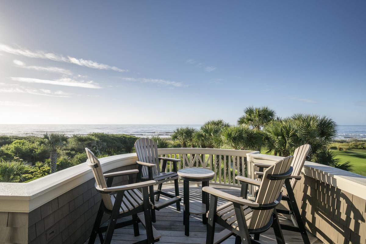 The layout of the home was designed to maximize both views and livability. Six of the seven bedrooms enjoy ocean views, and five offer direct access to decks overlooking the water or golf course.