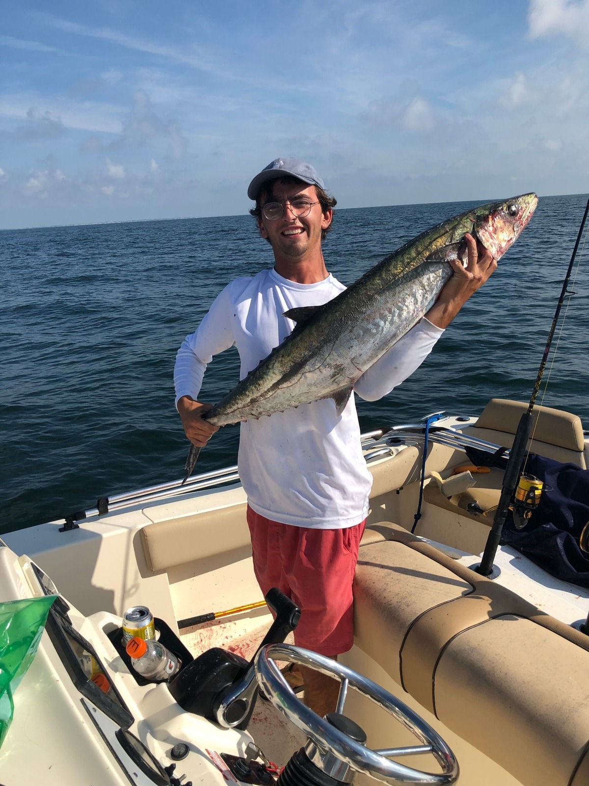 Jackson Tomaszewski holds the King Mackerel that jumped into his boat while fishing on July 4.