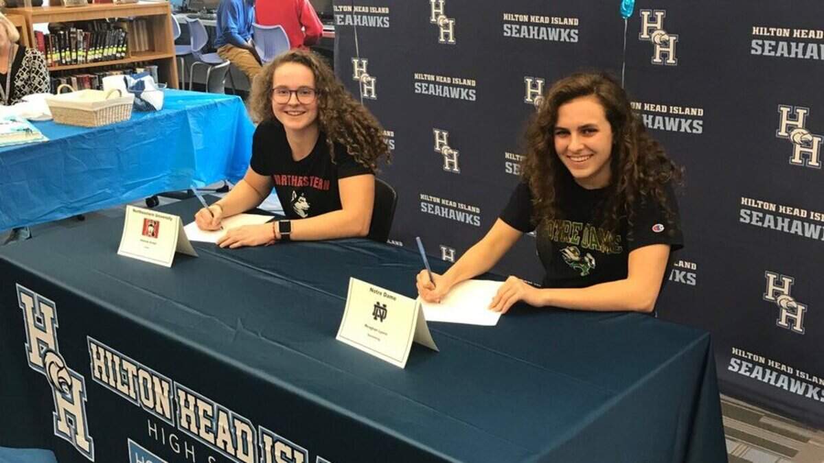 Hilton Head’s Hannah Axtell, left and Meaghan Lyons sign their national letters of intent Wednesday on National Signing Day.