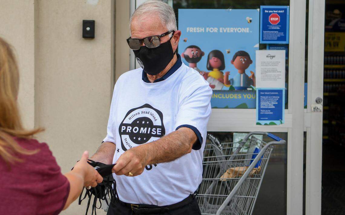 Hilton Head Island Mayor John McCann distributes free face coverings supplied by the The Hilton Head Island/Bluffton Chamber of Commerce on Saturday, June 27, 2020 at the Kroger in Shelter Cove Towne Centre on Hilton Head Island. On Monday, Hilton Head leaders passed an ordinance that will make masks mandatory for customers in all commercial spaces beginning at 11:59 p.m. on Tuesday. The 500 masks were given away in about 30 minutes.