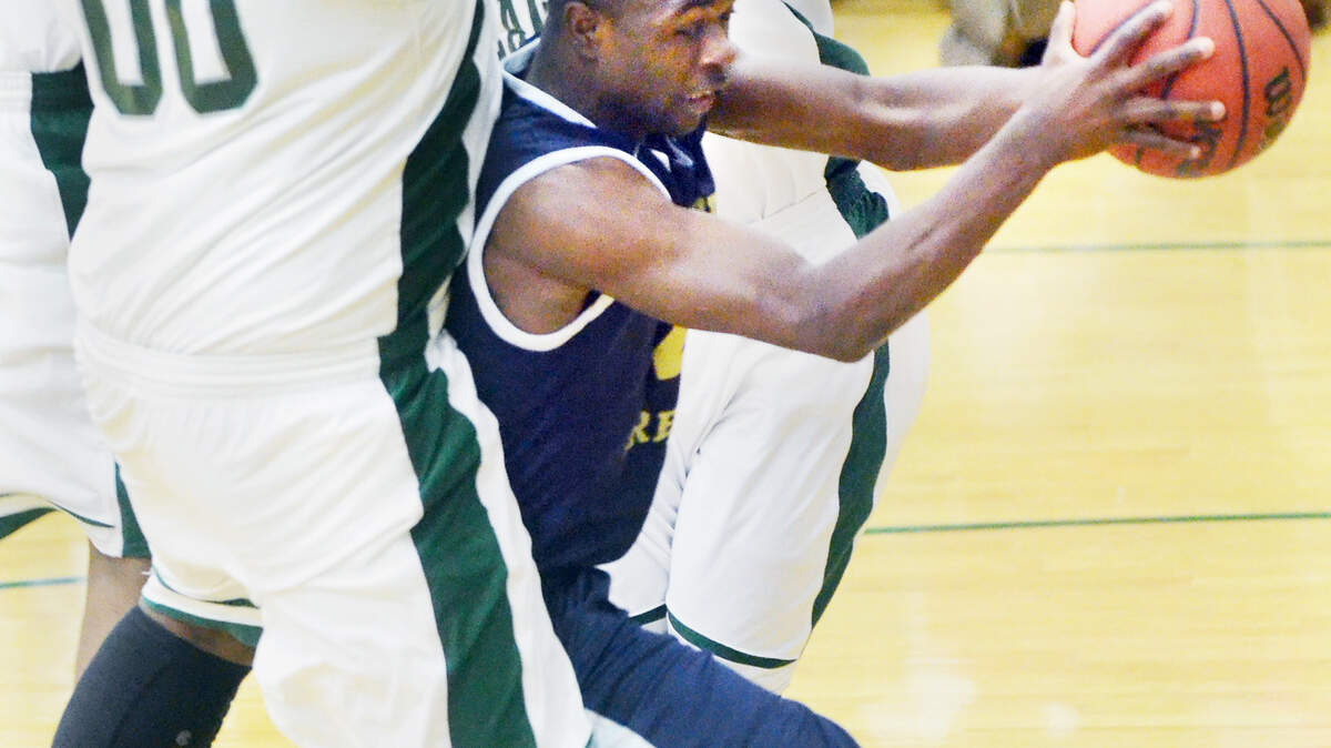 Battery Creek's Markell Smalls, center, finds himself hemmed in by Beaufort's Flint Wright and Otis McClain (00) during Thursday's game.