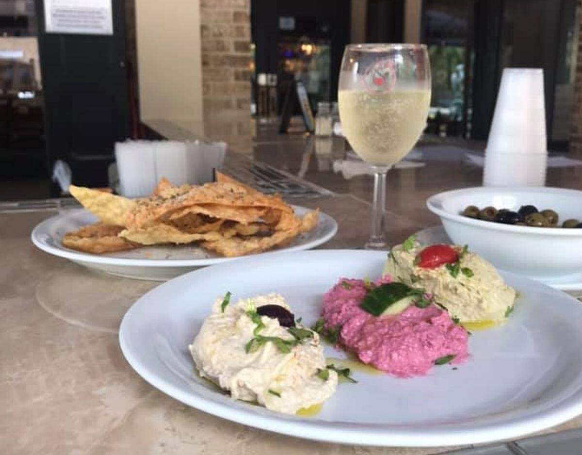 Three types of hummus come on The Other Sister’s Wine Bar’s hummus plate.