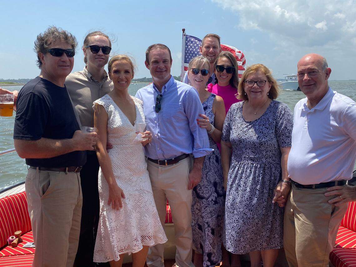 Shannon and Jon Eggert, center, with their wedding guests on Aug. 1 on Hilton Head Island.