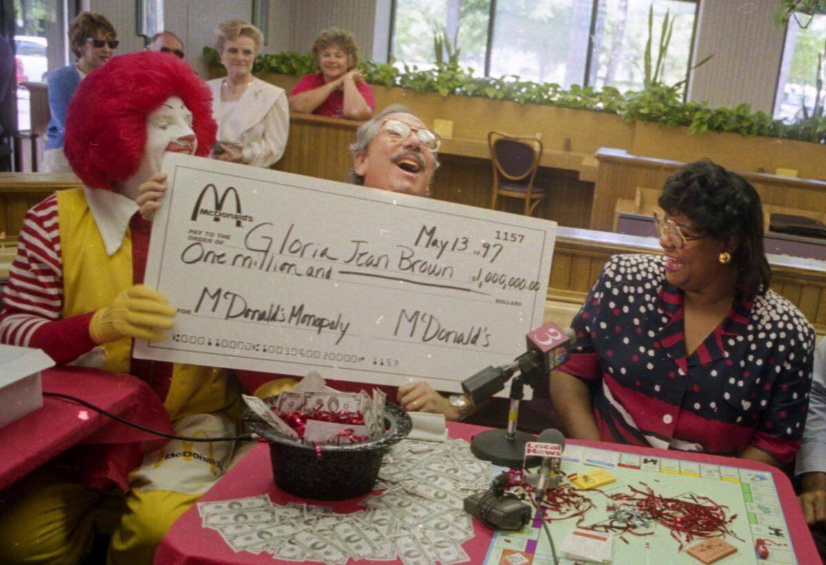 In this photo, which ran on the front page of The Island Packet in May 1997, Gloria Brown (right) accepts a ceremonial check from Hilton Head McDonald’s owner Mark Stern after she won the restaurant’s Monopoly game. Stern had no idea Brown was part of a nationwide scam to defraud the company of $24 million over 12 years.