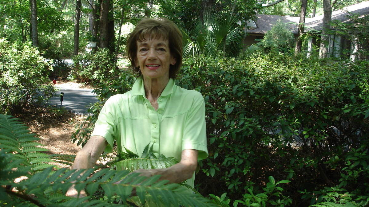 Betsy Jukofsky in her plant-filled yard in Hilton Head Plantation