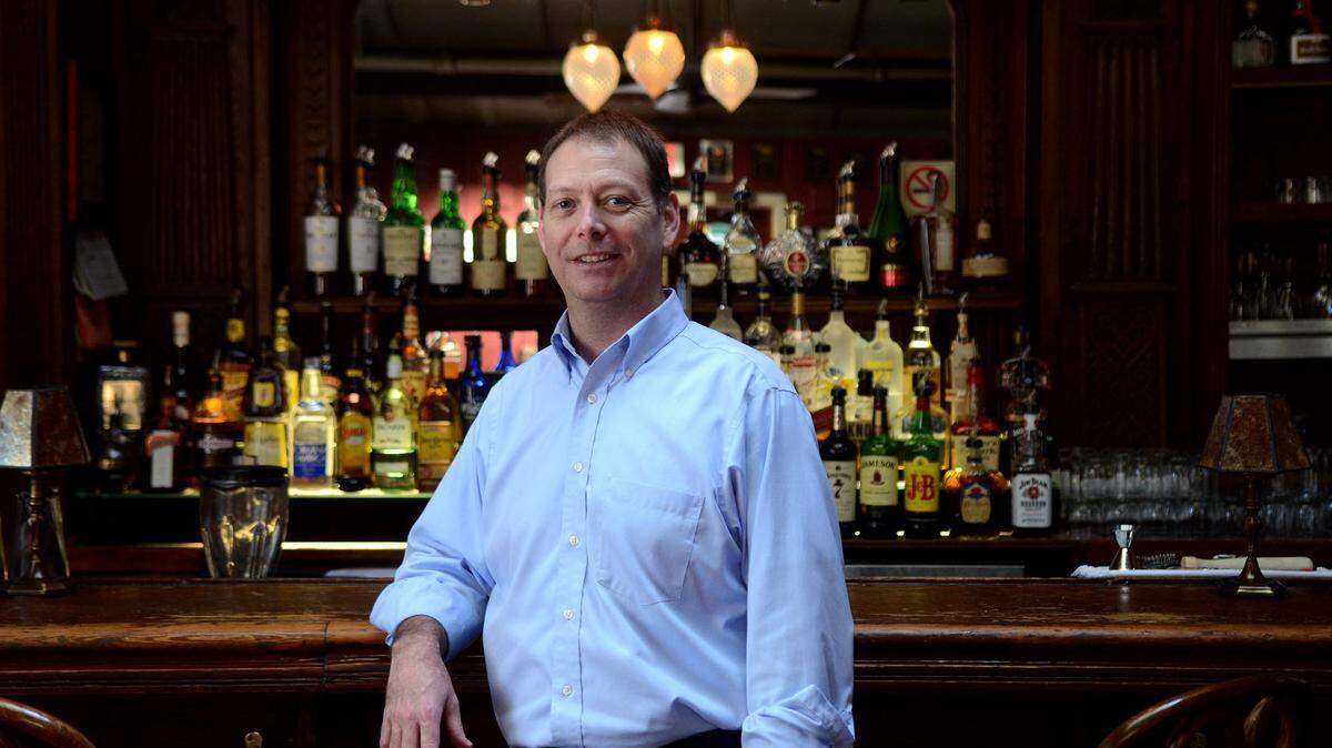 Eric Thompson, general manager at CQ's Restaurant, stands for a portrait at the bar inside of the restaurant on Hilton Head Island.  Thompson has never seen the Blue Lady that is said to haunt the restaurant but he has heard footsteps, seen the lights flicker and witnessed the liquor bottles behind the bar begin to shake with no explanation.
