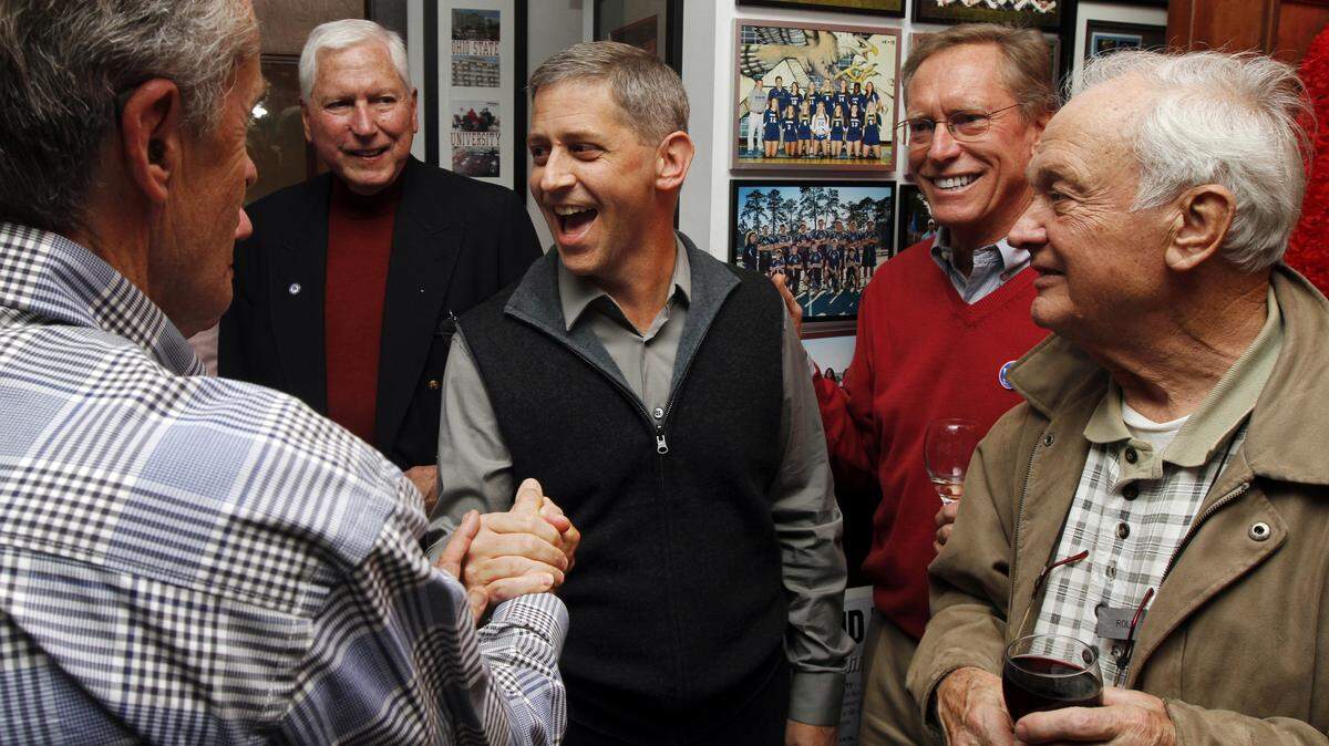 David Bennett is congratulated by supporters on Nov. 19, 2014 at Mangiamo restaurant moments after he won Hilton Head Islands mayoral runoff.