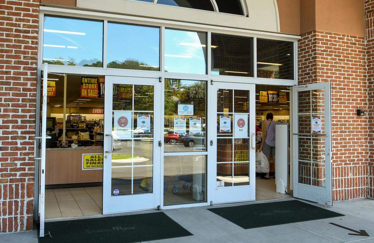 Signs announcing the closing of Bluffton’s Stein Mart hang from the ceiling of the department store on Aug. 17, 2020.