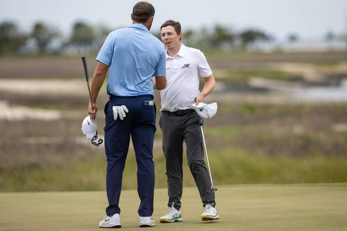 Matt Fitzpatrick of England and Scottie Scheffler of the United States shake hands on the 18th hole during the final round of the RBC Heritage Presented by Boeing at Harbour Town Golf Links on Sunday, April 19, 2026, in Sea Pines on Hilton Head Island.