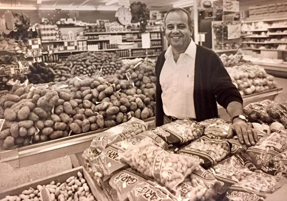 Gene Martin is pictured in 1986 in the Coligny Plaza grocery store he and his family have run since May 1969.
