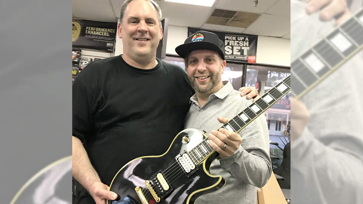 Scott Evans (left) and Alan Price pose with Price’s Gibson Vintage Original Spec 1957 Les Paul, a guitar that was missing for a decade, on Monday, Dec. 31, 2018, at John’s Music store on Hilton Head Island, S.C.