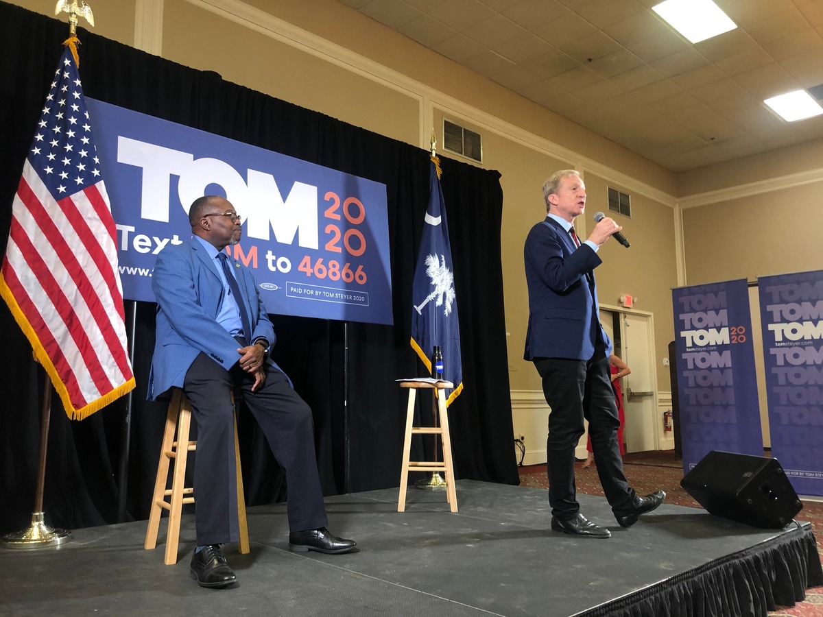 Tom Steyer, right, speaks at Hilton Head Island Beach & Tennis Resort on Monday with Rep. Michael Rivers.