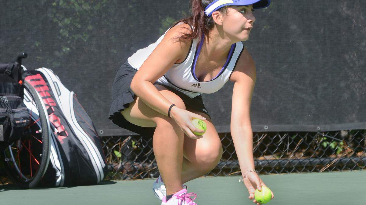 Bluffton High School tennis team member Angie Castrillon volunteers as a ball girl during the Fall Southern PTR Wheelchair Tennis Championships on Saturday at Chaplin Park.