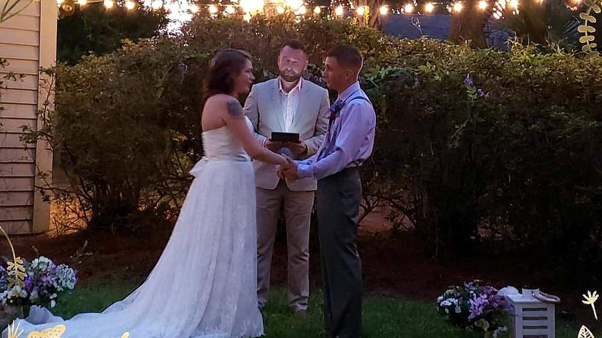 Garrett and Haley Hunter exchange vows on Friday, Sept. 14 in the backyard of their rental home in Sea Pines. The couple lost their reservation at a reception hall on the island due to Hurricane Florence, so family and friends helped improvise a backyard wedding.