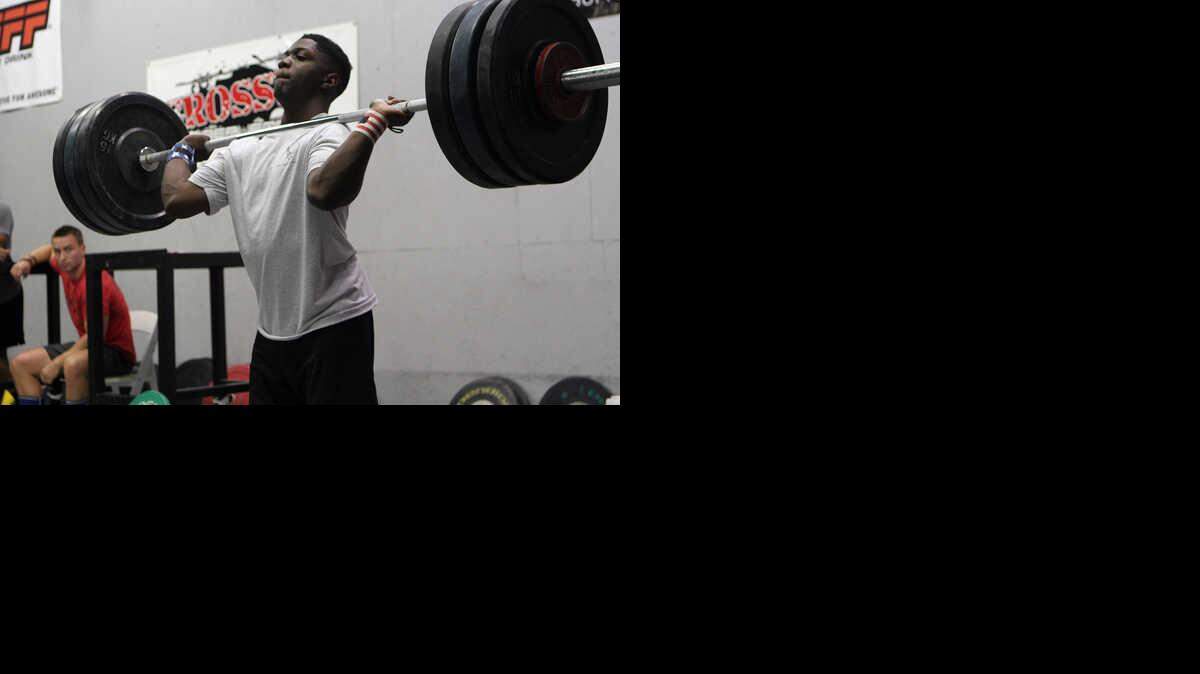 FILE: CJ Cummings practices the push jerk while training at Crossfit Beaufort.