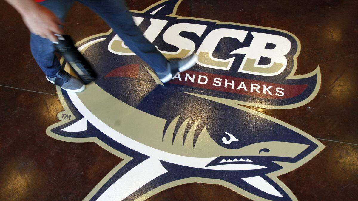 A student is seen walking over the Sand Shark logo after entering the new Sand Shark Recreation Center on the University of South Carolina Beaufort?s Hilton Head Gateway campus on February 5, 2015.