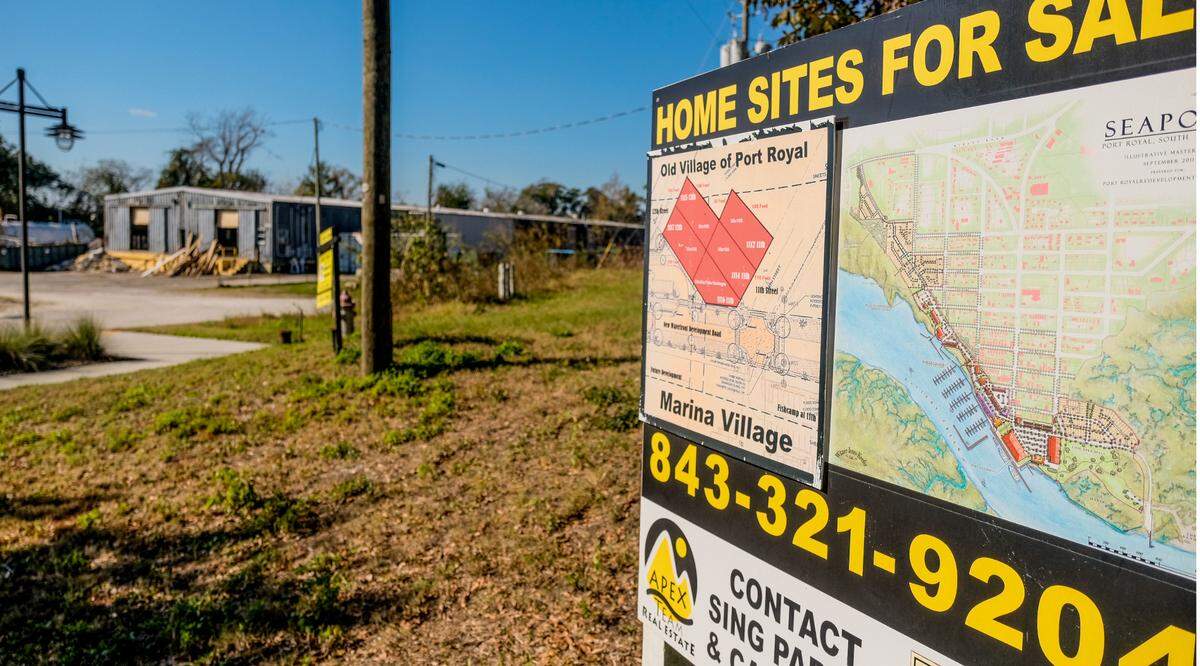 A real estate sign advertises the master plan for home sites in Seaport for the Port of Port Royal property in this photo taken on Dec. 18, 2020 in the Town of Port Royal. The former shrimp processing facility at 11th Street Docks can be seen in the background.