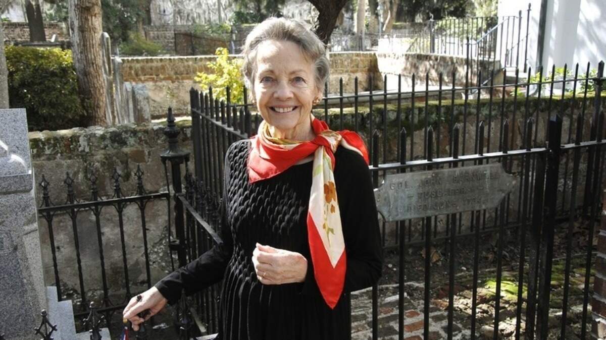 Lin Mix of Beaufort is celebrating her 50th anniversary with the Daughters of the American Revolution. Here, she stands beside the tomb of Col. John “Tuscarora Jack” Barnwell in the cemetery at The Parish Church of St. Helena (Episcopal).