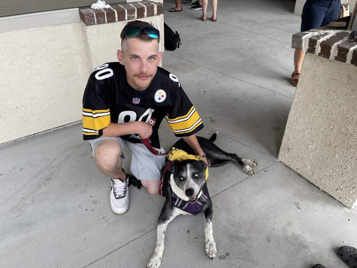 John Kuhn’s brother, Jason Kuhn, poses with dog Pepper at Lowcountry Celebration Park on Sep. 27, 2025.