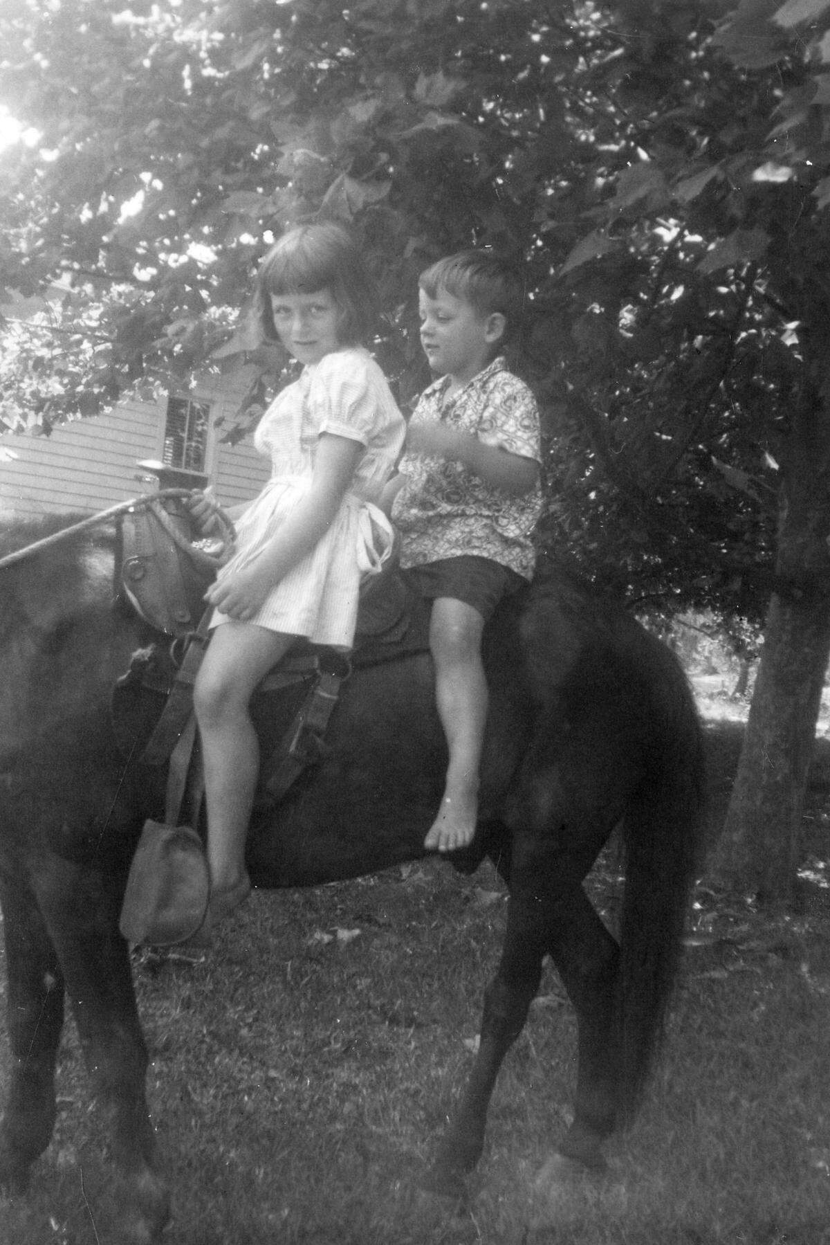 Avary and her younger brother, Frederick Hack, on Blackie in the yard at Honey Horn in 1951. Their brother, Byron, was born in 1952 in Savannah.