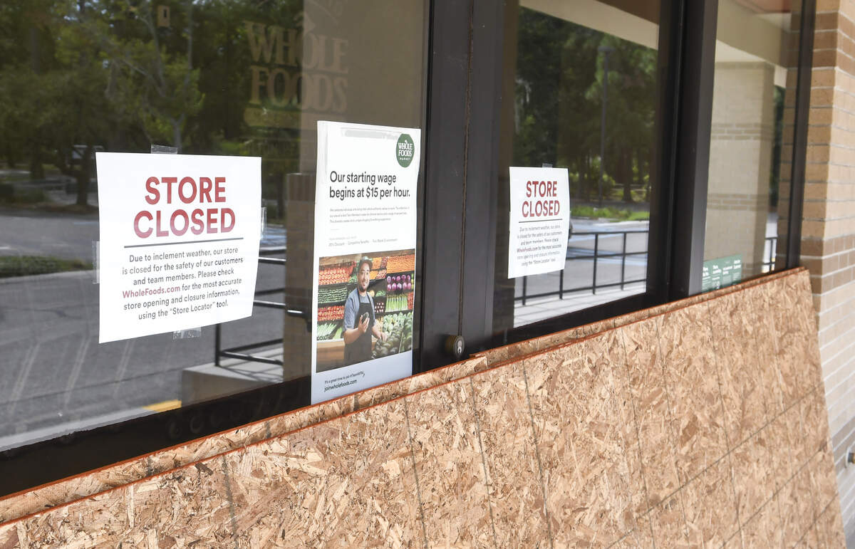 Plywood rests on the sidewalk in front of Whole Foods on Hilton Head Island Tuesday morning in order to board up the grocery store in preparation for the arrival of Hurricane Dorian. The slow-moving storm is expected to move up the east coast in the next few days, side swiping Georgia, the Carolinas before heading out to sea.