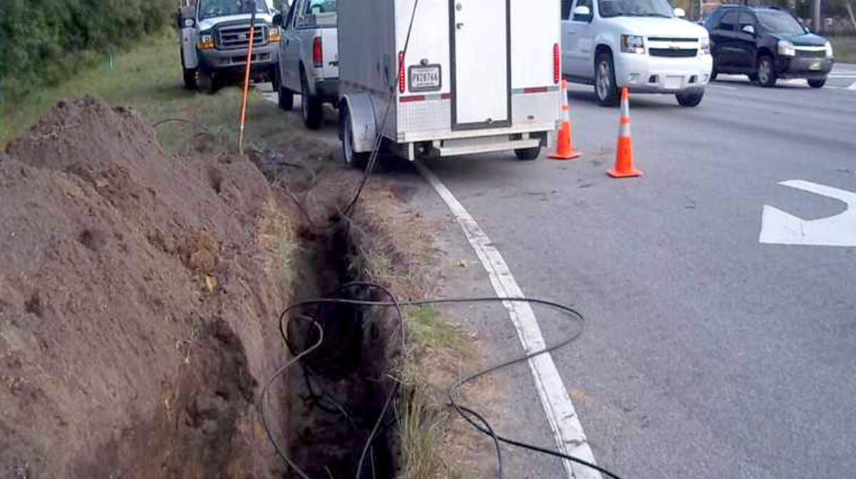 FILE: Hargray Communications technicians work to restore service during an outage Oct. 15, 2012, after the company's cable was accidentally cut across from Tanger Outlet Center 1 in greater Bluffton.