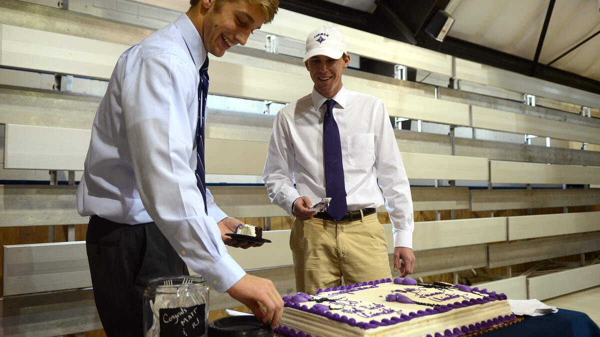 RJ Bartolomucci, left, and Matt Lehman cut pieces of cake for everyone that attended their college signing ceremony on Tuesday afternoon at Hilton Head Christian Academy.  Both will be playing golf, Bartolomucci will be attending High Point University and Lehman will be attending Furman University.