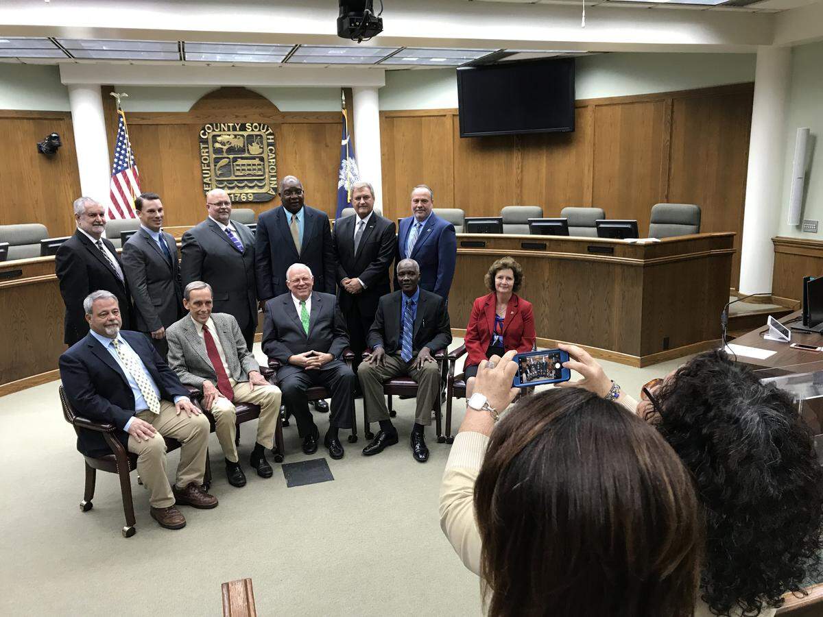 Newly-elected Beaufort County Council Chairman Stu Rodman (center, seated) and his colleagues pose for their official county photo after a specially called meeting Monday, Jan. 7, 2019, in Beaufort, S.C.