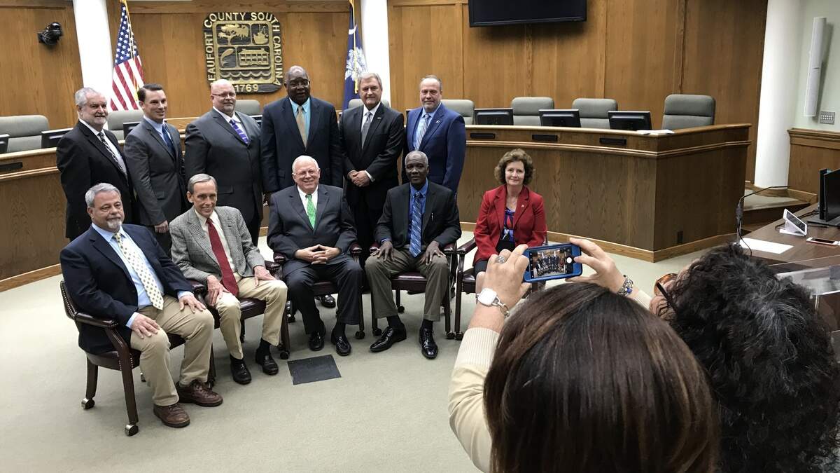 Newly-elected Beaufort County Council Chairman Stu Rodman (center, seated) and his colleagues pose for their official county photo after a specially called meeting Monday, Jan. 7, 2019, in Beaufort, S.C.