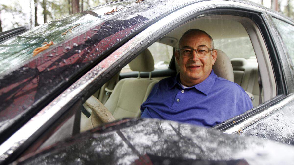 John Vinci, Uber driver, sits for a portrait in the Island Packet parking lot after an interview with staff reporter Rebecca Lurye on March 27, 2015.  Today, starting at 2pm, uberX hit the streets in Hilton Head. Now residents and visitors can request the safest ride on the road at the touch of a button.  To watch a video, go to:Êhttp://bit.ly/1gf1c6W