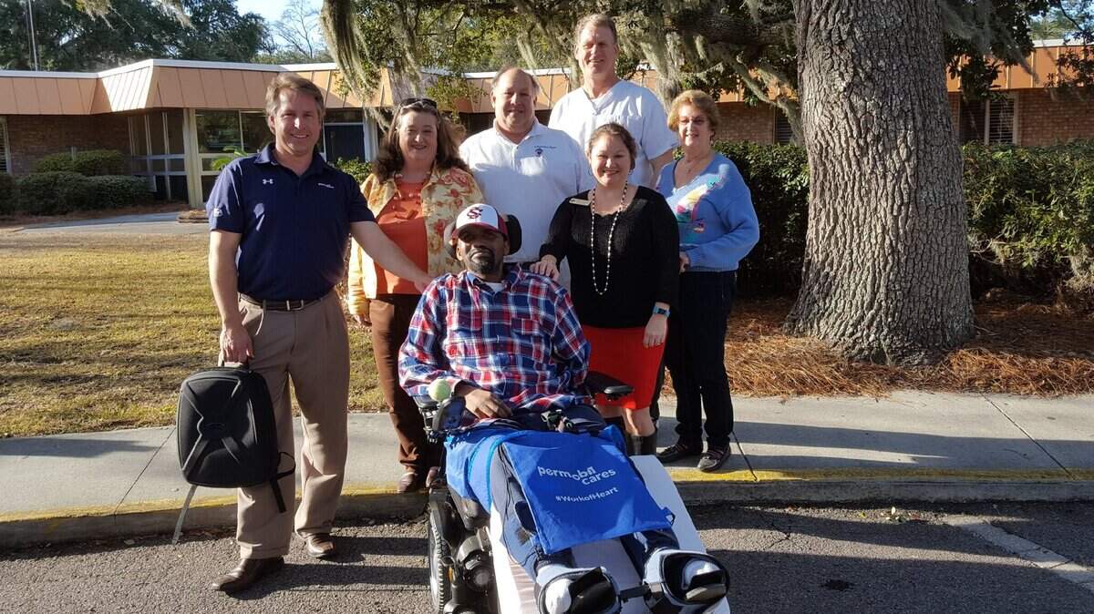 Bradley Cummings, a 33-year-old resident at the Bayview Manor assisted living facility in Beaufort, S.C., was gifted a new, power wheelchair for free. Allan Snyder (third from left), owner of Independent Again, orchestrated the operation with the help of Carolyn Roos, a staff member at the nonprofit organization the Lending room, and Michael Duda, a local sales representative for a power wheelchair manufacturer.
