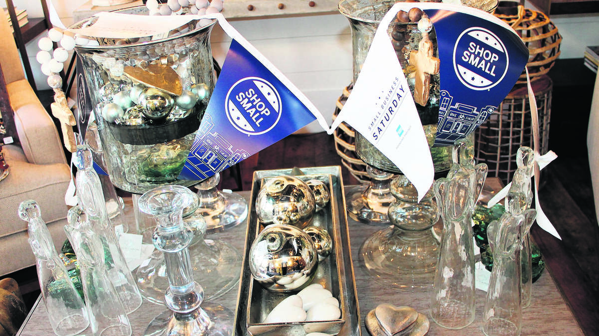 Merchandise from Bluffton's Kelly Caron Design prominently displaying "Shop Small", a push for holiday shoppers to visit local stores for Small Business Saturday the day after Black Friday.